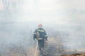 Firefighters battle a wildfire. firefighters spray water to wildfire. Australia bushfires, The fire is fueled by wind and heat