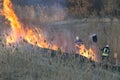 Firefighters battle a wildfire in spring.