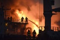 firefighters battling blaze on cargo ship deck