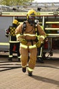 Firefighters in breathing apparatus on the move