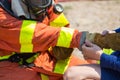 Firefighters buddy help to wearing fire protection gloves