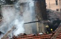 Firefighters burning house