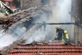 Firefighters burning house