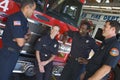 Firefighters chatting by a fire engine