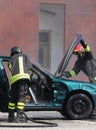 Firefighters check the incident car after the car accident