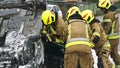 Firefighters cutting car doors to rescue viction of the car crash accident