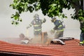 Firefighters Cutting Through Roof Royalty Free Stock Photo