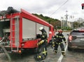 Firefighters deploy equipment from a fire truck in the center of Kiev