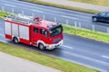. Fire engine driving down street Royalty Free Stock Photo