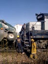 Firefighters and officials investigate a train collision