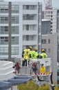 Firefighters exercise on a fire engine ladder Royalty Free Stock Photo