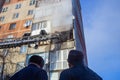 Firefighters extinguish a fire while climbing the stairs, risking their lives in danger in a multi-story building