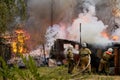 Firefighters extinguish a fire in a garage Royalty Free Stock Photo