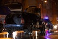 Firefighter extinguishing fire into car with water after accident at roadside. Kharkov, Ukraine, 22.10.2021