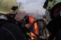 Firefighters fight the fire flame to control fire not to spreading out. Firefighter industrial and public safety concept