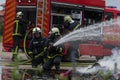 Firefighters fight the fire flame to control fire not to spreading out. Firefighter industrial and public safety concept