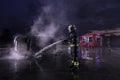 Firefighters fight the fire flame to control fire not to spreading out. Firefighter industrial and public safety concept