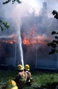 Firefighters fight a house fire