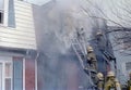 Firefighters fighting a fire at a townhouse in Palmer Park, Maryland