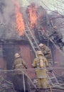 Firefighters fighting a house fire