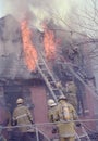 Firefighters fighting a house fire