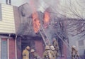 Firefighters fighting a house fire