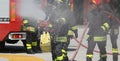 firefighters with the fire extinguisher during a practice session Royalty Free Stock Photo
