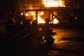 Firefighters kneeling in preparation to fight fire in firefighting exercise Royalty Free Stock Photo