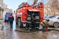 Firefighters of the Ministry for Emergency Situations of the Russian Federation use a fire hydrant next to the fire truck