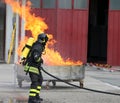 Firefighters with oxygen bottles off the fire during a training Royalty Free Stock Photo