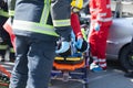 Paramedics and firefighters in a rescue operation after a car crash Royalty Free Stock Photo