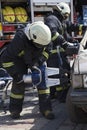 Firefighters with the pneumatic shears open the car doors Royalty Free Stock Photo