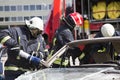 Firefighters with the pneumatic shears open the car doors Royalty Free Stock Photo