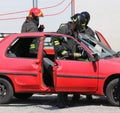 firefighters with pneumatic shears to the rescue after the road