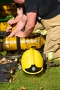 Firefighters prepare breathing apparatus at fire scene Royalty Free Stock Photo