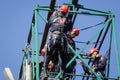 Firefighters are rappelling and climbing ropes