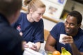 Firefighters relaxing in the staff kitchen Royalty Free Stock Photo