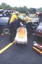 Firefighters remove an injured person from a car