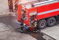 Firefighters rescue extinguish a fire in a residential building. Necessary fire equipment in a fire truck, help