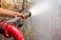 firefighters spray water to wildfire Royalty Free Stock Photo