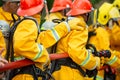 Firefighters spraying high pressure water to fire with copy space, Big bonfire in training, Firefighter wearing a fire suit for