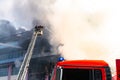 Firefighters on stairs extinguish a big fire Royalty Free Stock Photo