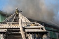 Firefighters on the stairs extinguish a fire on the roof of a residential high-rise building. top view