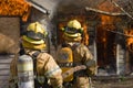 Firefighters standing by Royalty Free Stock Photo