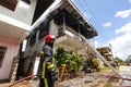 Firefighters of the Surinamese fire brigade extinguish a burning house in the center of Paramaribo, Suriname, South America