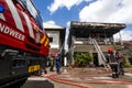 Firefighters of the Surinamese fire brigade extinguish a burning house in the center of Paramaribo, Suriname, South America