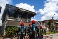 Firefighters of the Surinamese fire brigade extinguish a burning house in the center of Paramaribo, Suriname, South America