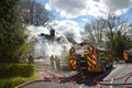 Firefighters tackle a fire in a rural cottage