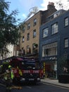 Firefighters tackling a blaze at London Pub Lore of the Land Royalty Free Stock Photo