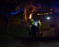 Firefighters tackling a blaze at night